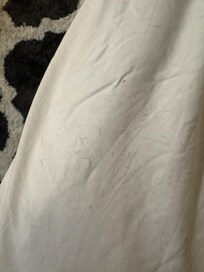 Animal hair on ALL OVER the roll-out bedsheet