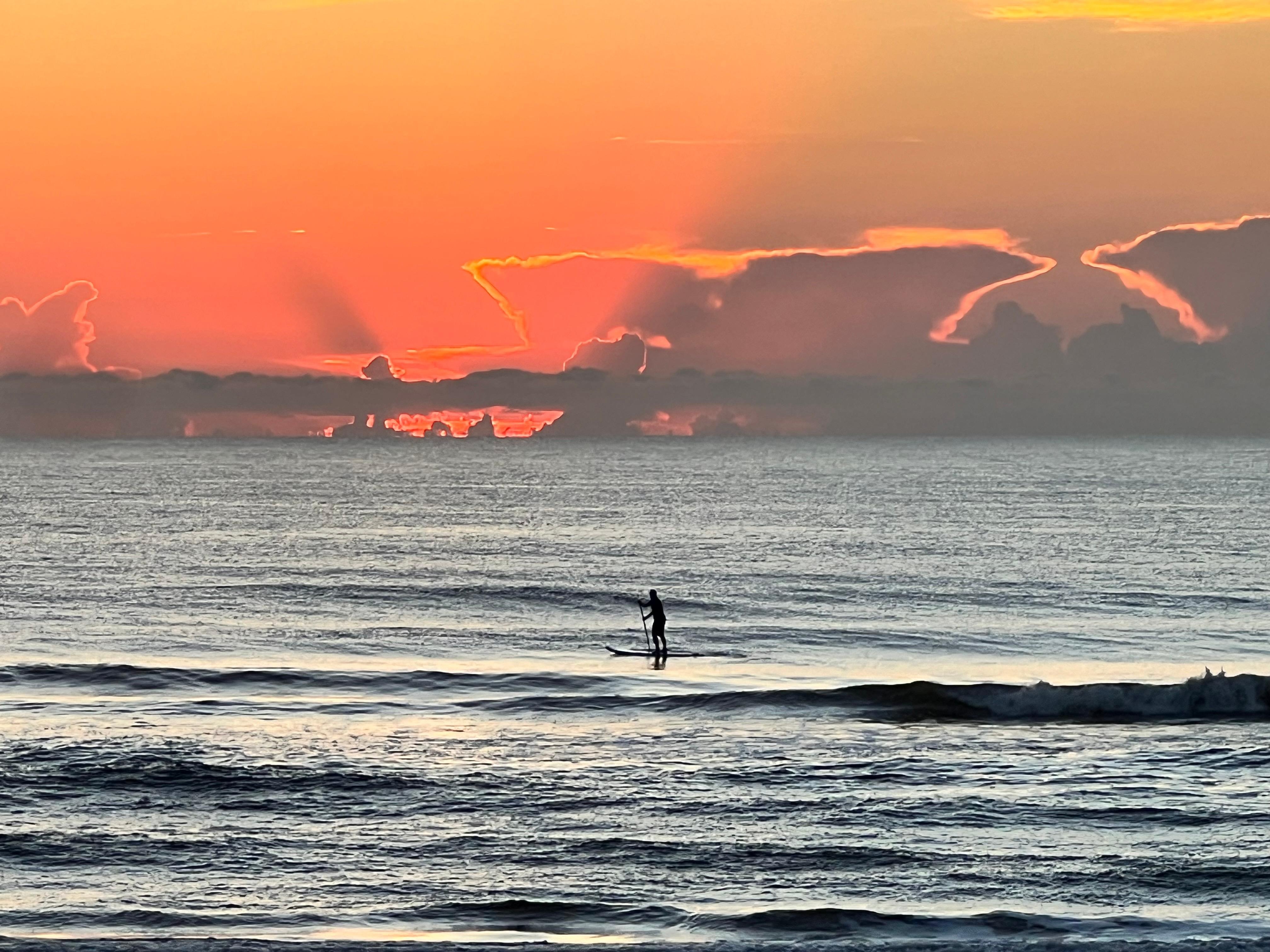 Paddle boarding in the early morning.