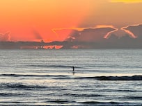 Paddle boarding in the early morning.