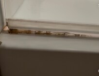 This is the bottom of the shower door. Absolutely disgusting! This is months of not cleaning properly