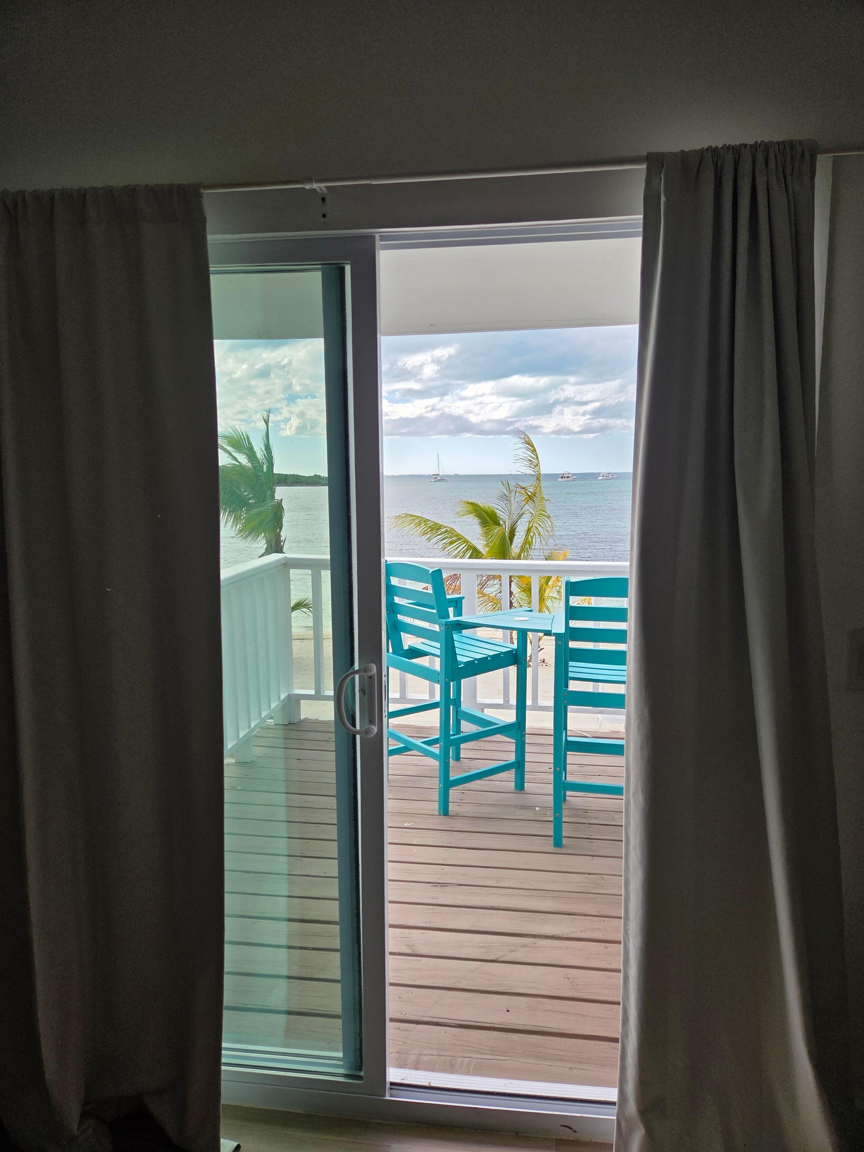 View of balcony and beach from room.