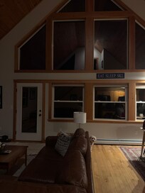 Daisy peeking out behind the couch on the first night! Too cute