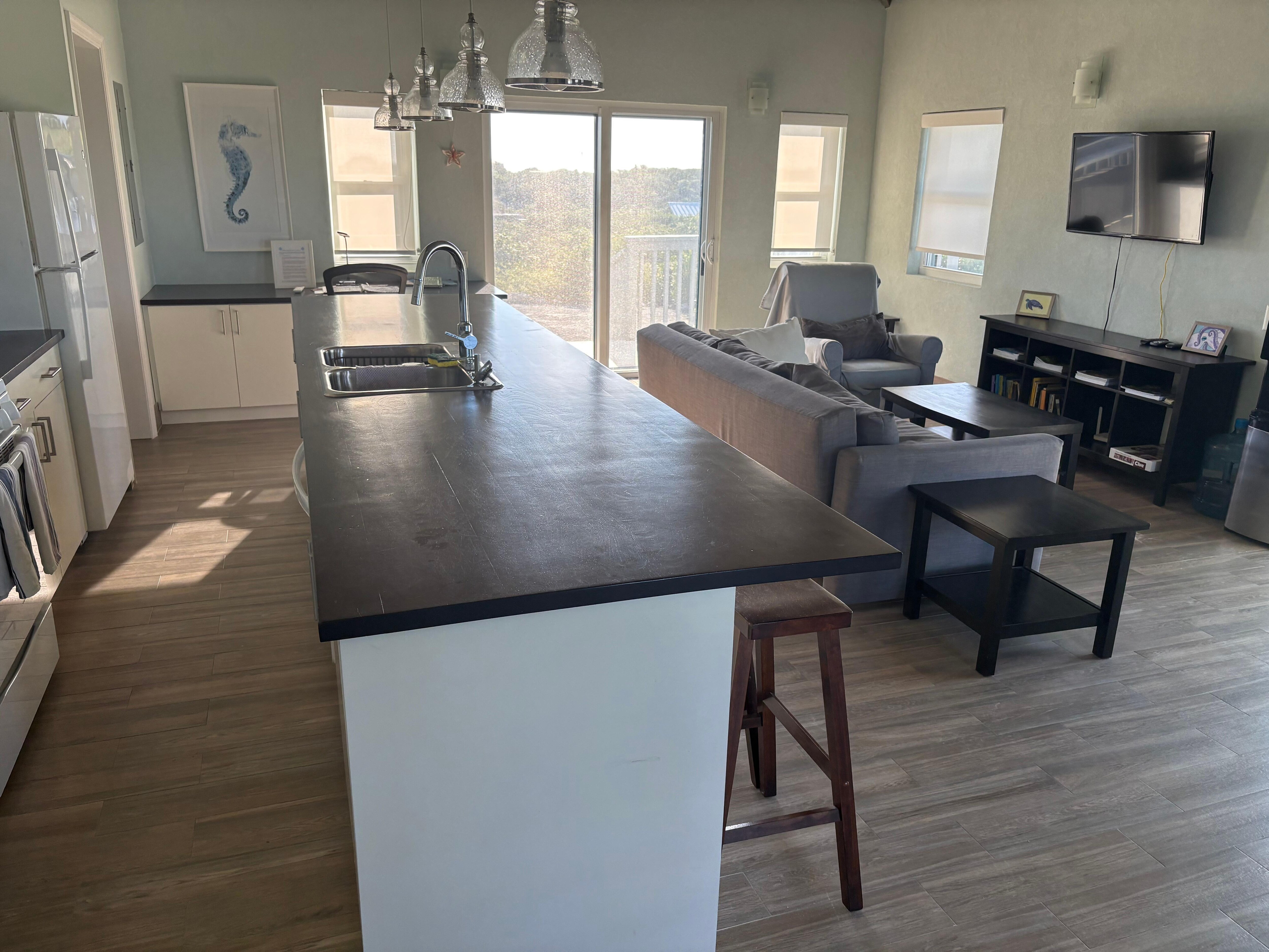 A spacious kitchen, living, and dining room area!