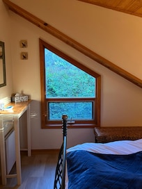 Bedroom has a cozy view and vibe