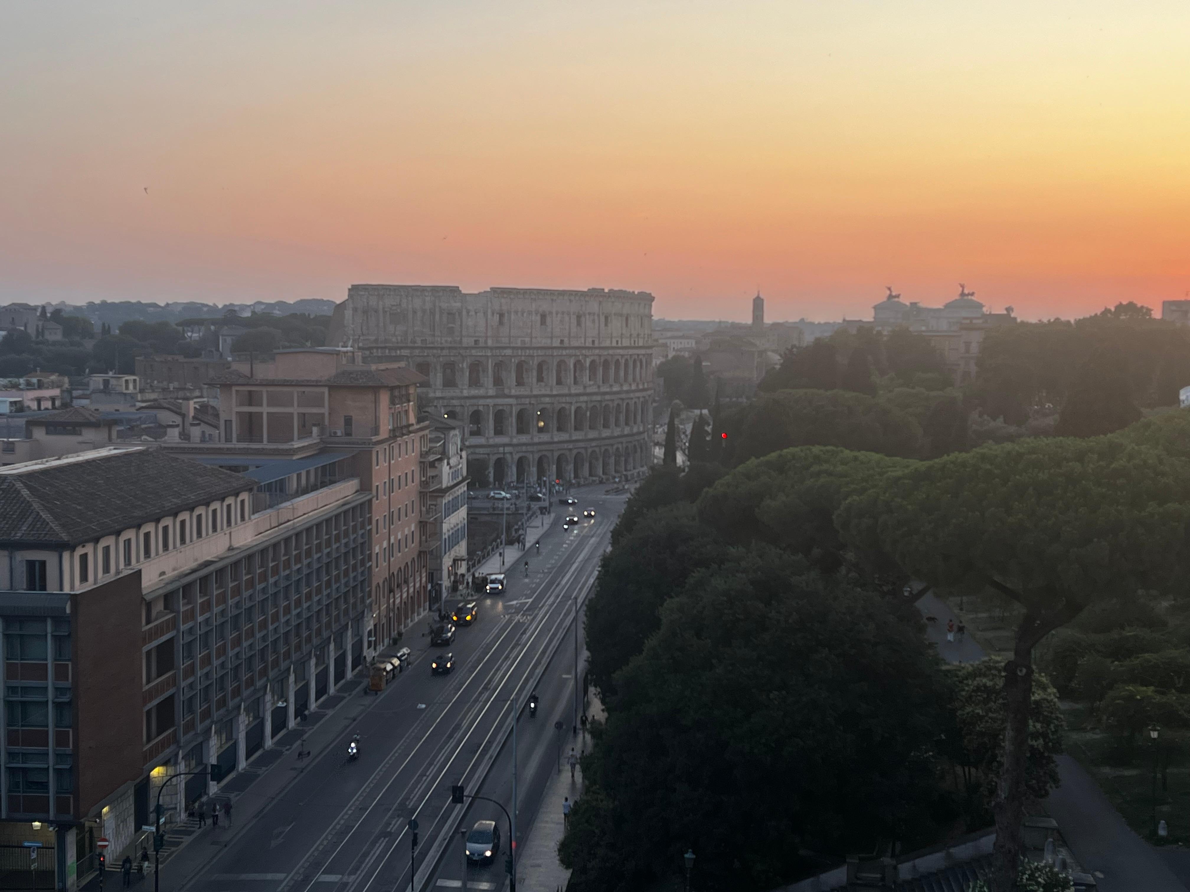 Pool at sunset overlooking Colosseum