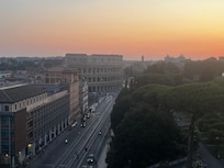 Pool at sunset overlooking Colosseum
