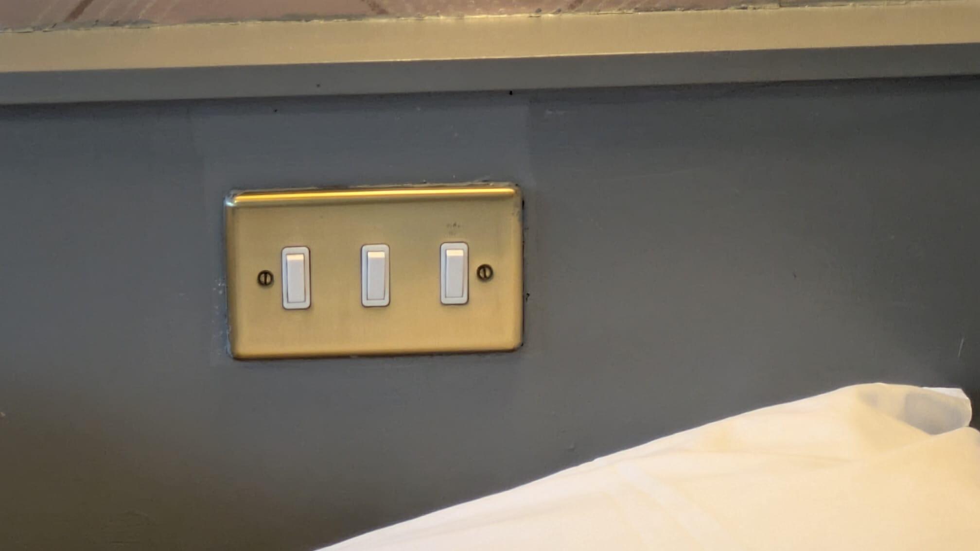 Light switches (plus TV power switch Lt hand switch) embedded in headboard