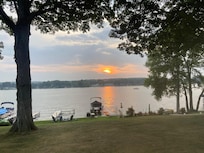 Sunset view of backyard from the beautiful screened porch.