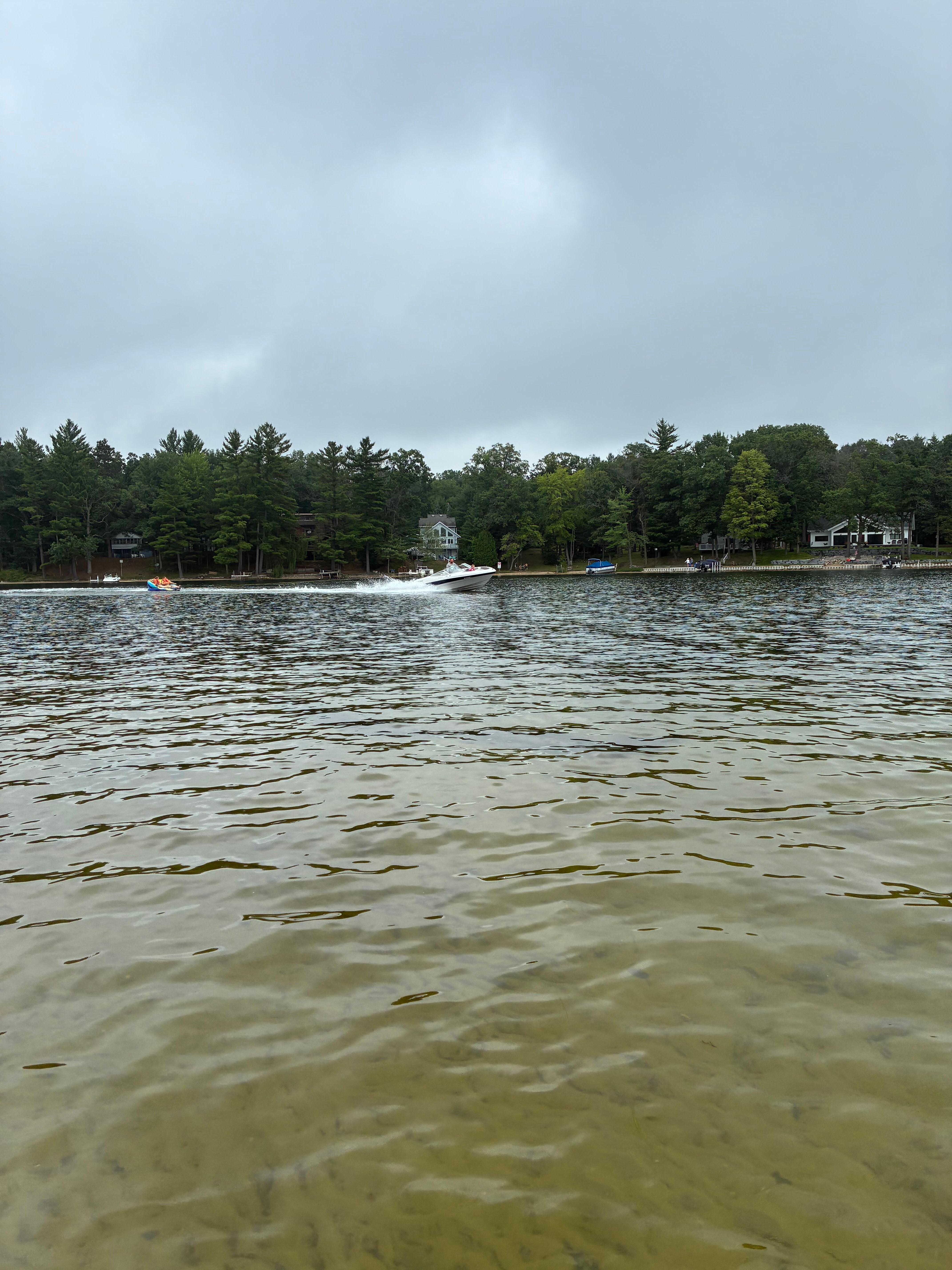 Pic taken In shallow sandy area by cabin while family tubed.
