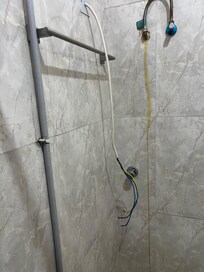 These were wires dangling from the shower wall in the bathroom. It’s supposed be the for the water heater. Very dangerous. They had to give me a different room