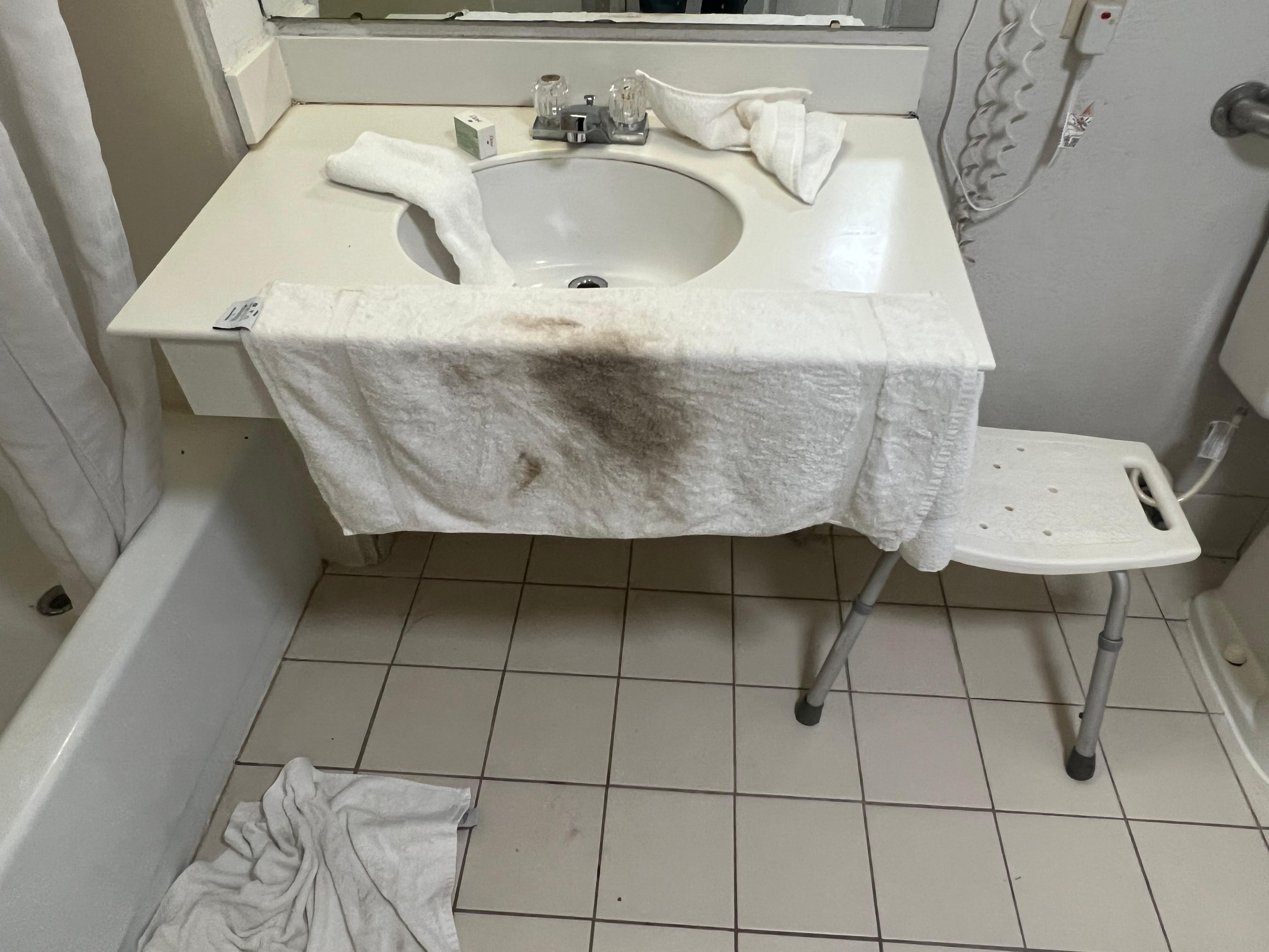 Bathroom sink after wiping it with towel