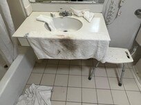 Bathroom sink after wiping it with towel