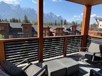 Balcony with comfortable furniture and great view of mountains