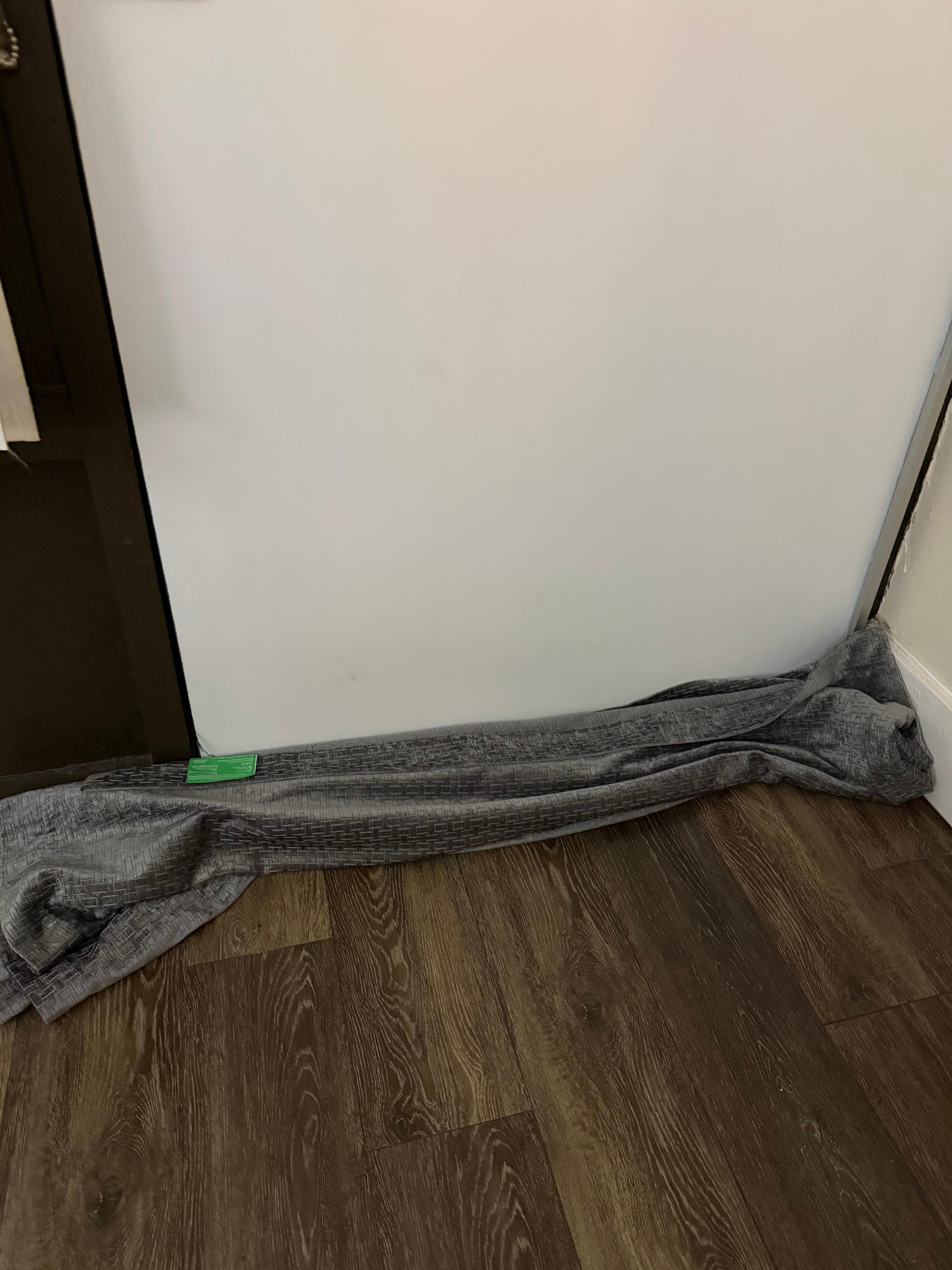 Blankets on the floor to attempt to keep cold out of room.