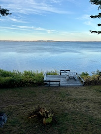 Standing inside the door looking out.