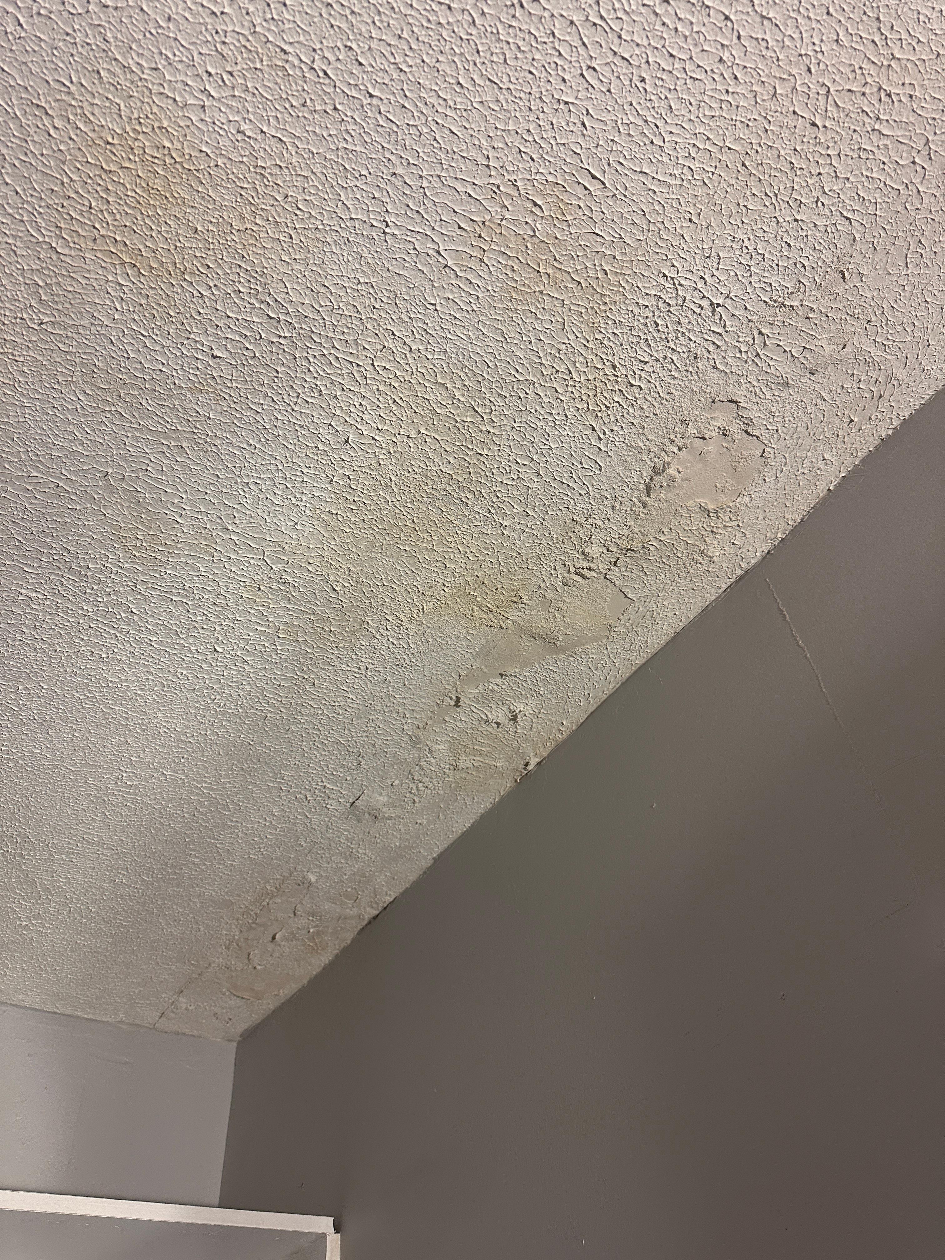 Water damage where spackle falls off onto the dresser. This place looks NOTHING like the pictures! The floor is also VERY un level. 