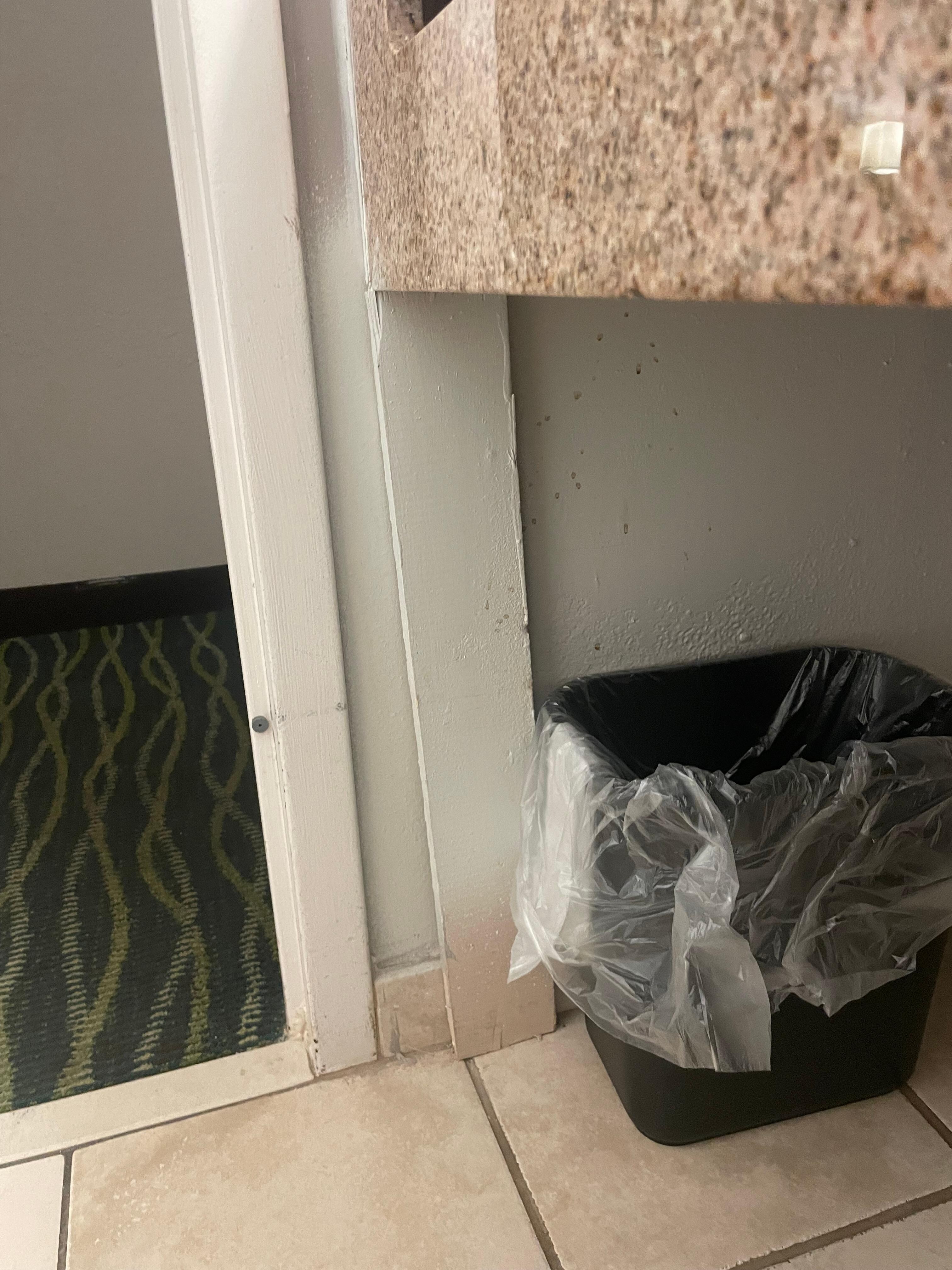 Board bracing up the bathroom counter