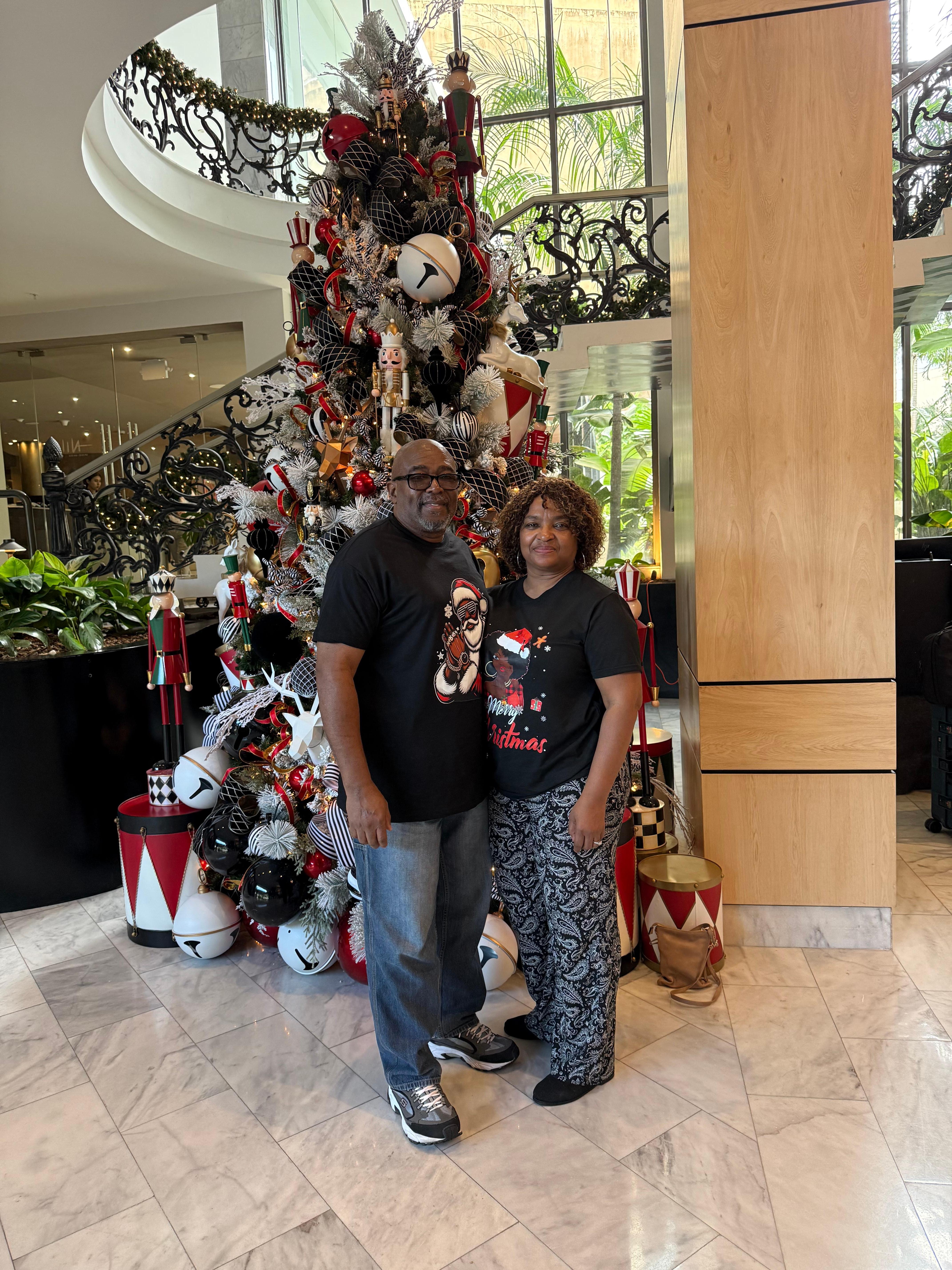 In the reception with their beautiful Christmas tree 