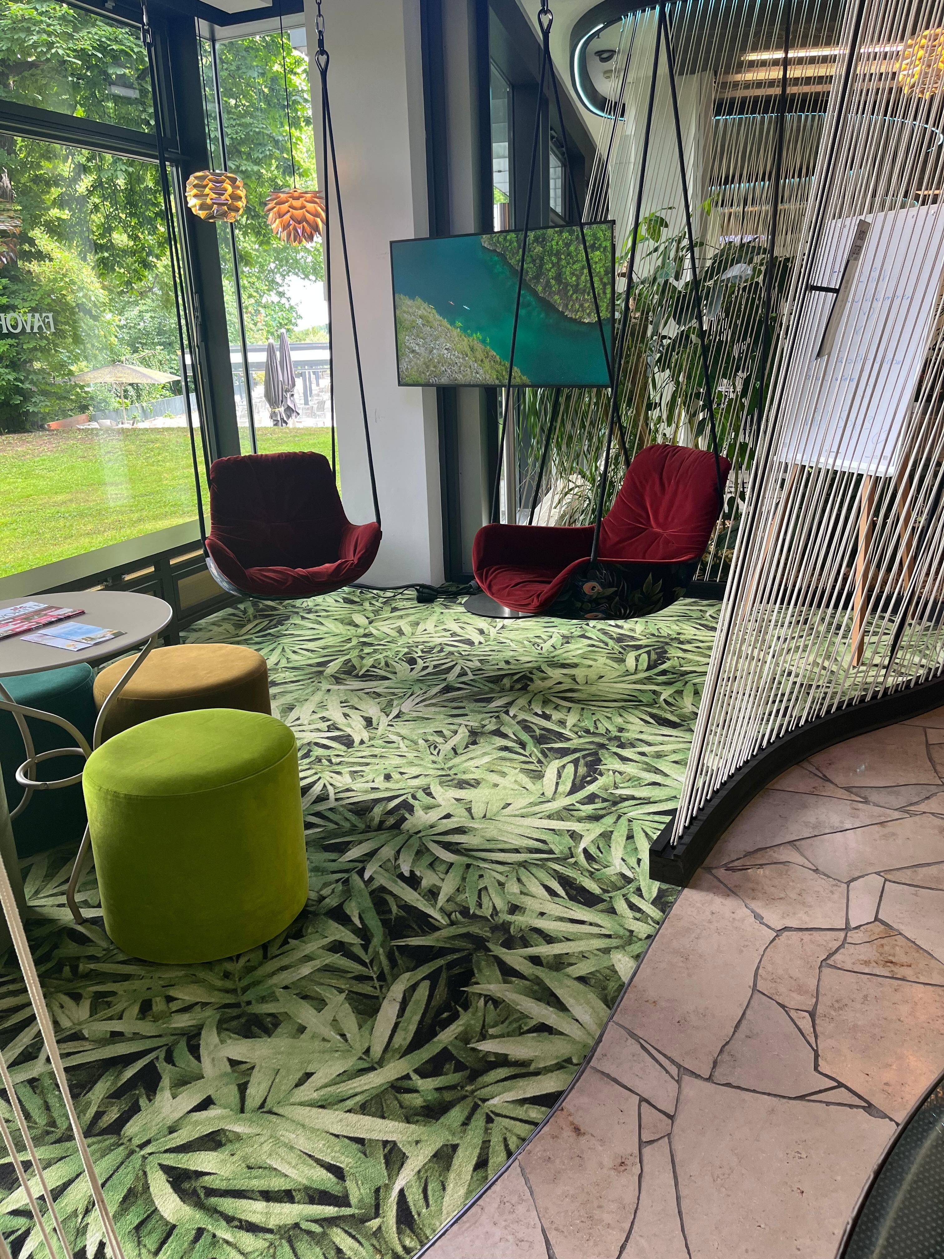 Lovely swing chairs in foyer looking out to park.