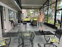 Screen room. Two sitting areas.