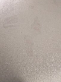 Children's footprints on bedding.