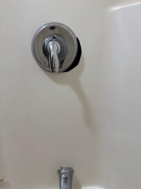 Hole in bathroom wall