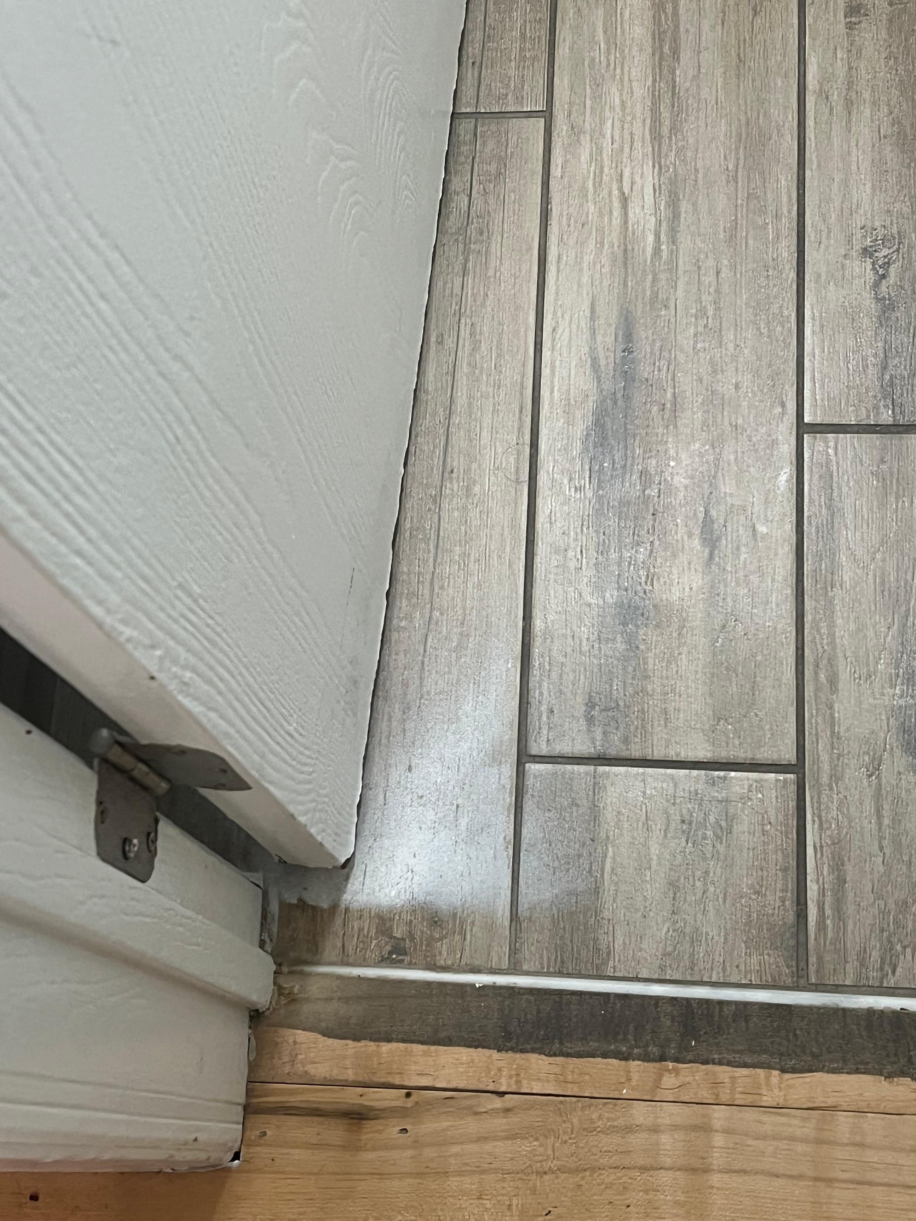 Painted the bathroom door and got it all over the floor