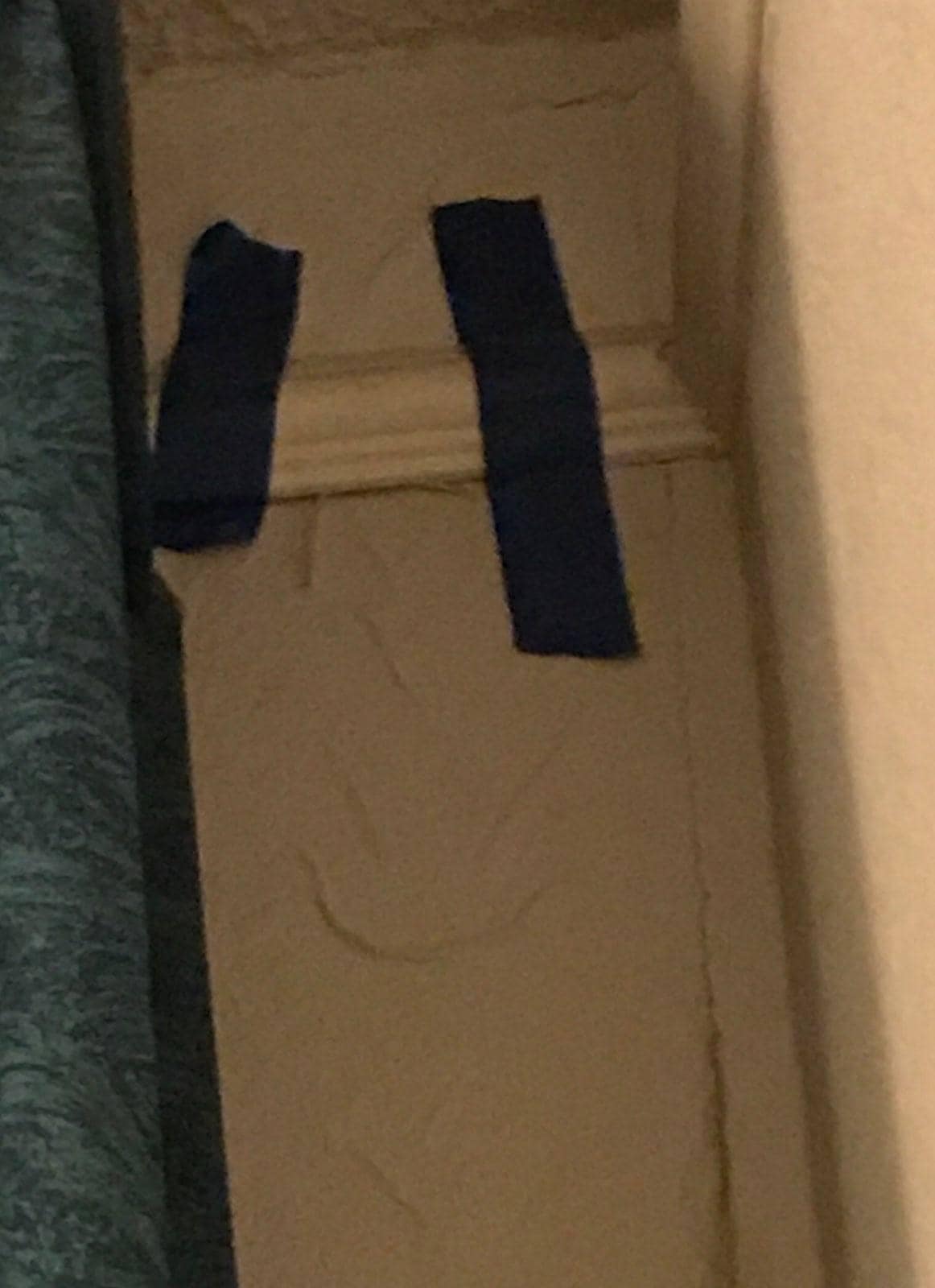 Tape holding together the molding on the wall