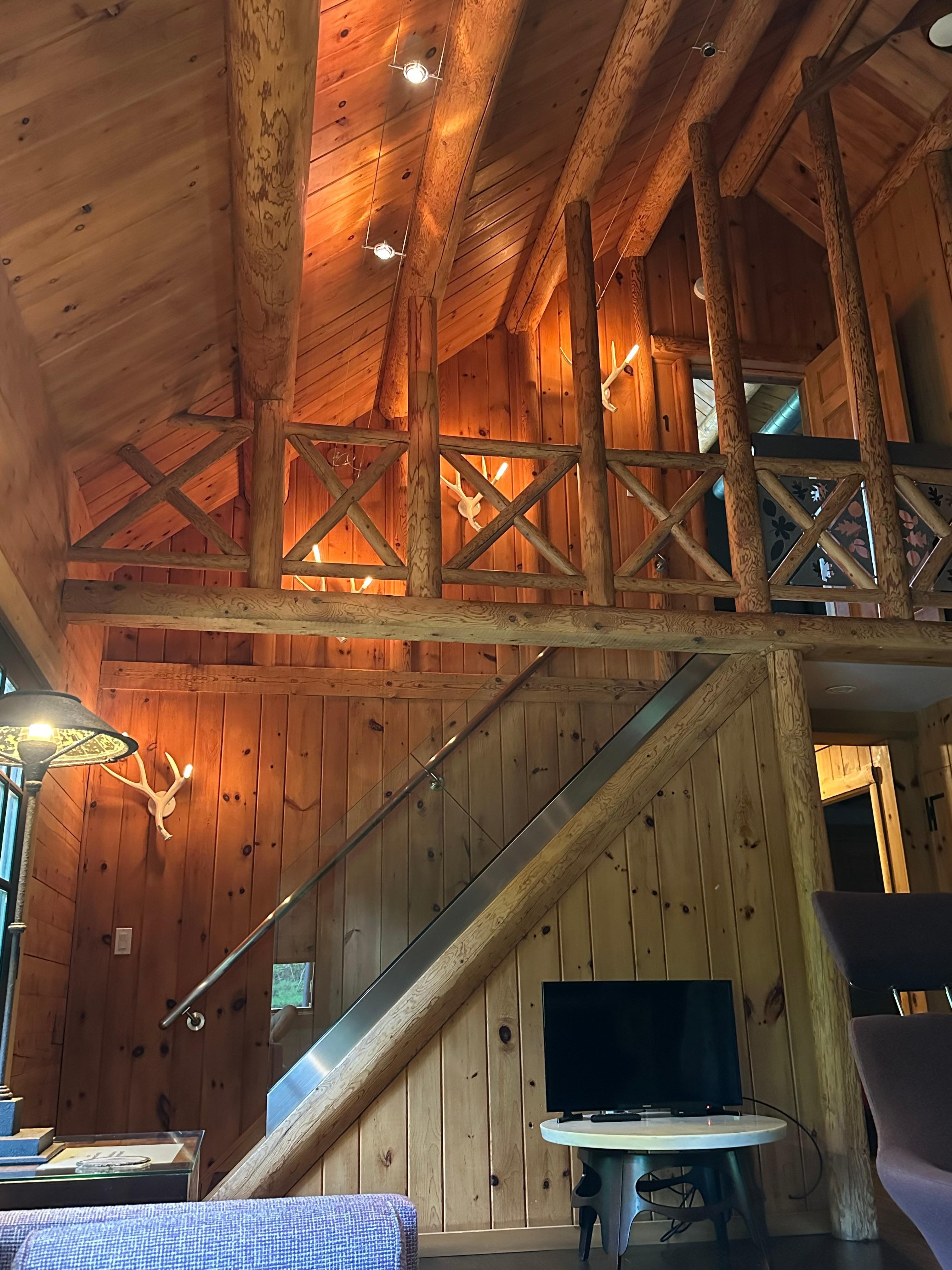 Stairs to upstairs bedroom with private bath.  Zoom in to check out the deer antler lamps along the stairs! 