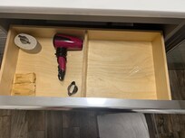 Bathroom drawers flooded due to pipe being disconnected.