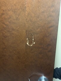 Hole in the back of the bathroom door.