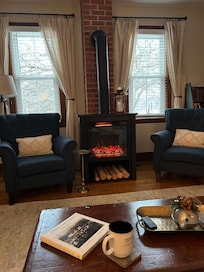 Morning coffee by the fireplace.