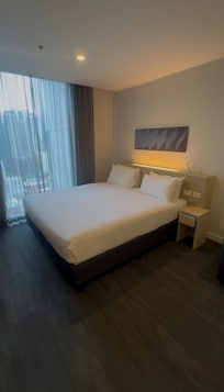 King size bed next to window with unblocked view