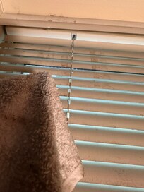 Water damaged leaked down the wall and onto blinds. Windows screwed shut, no emergency exit