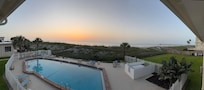 Pool and sunrise from balcony