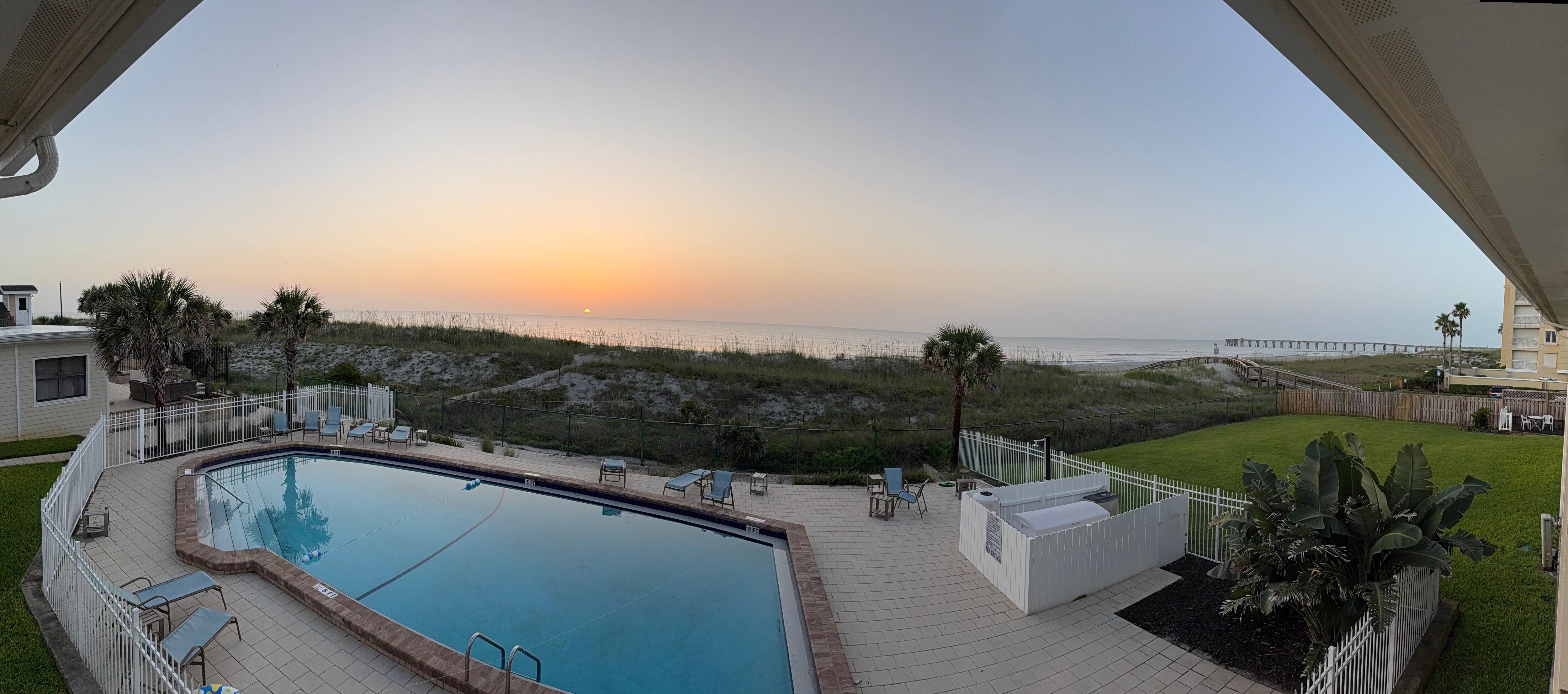Pool and sunrise from balcony