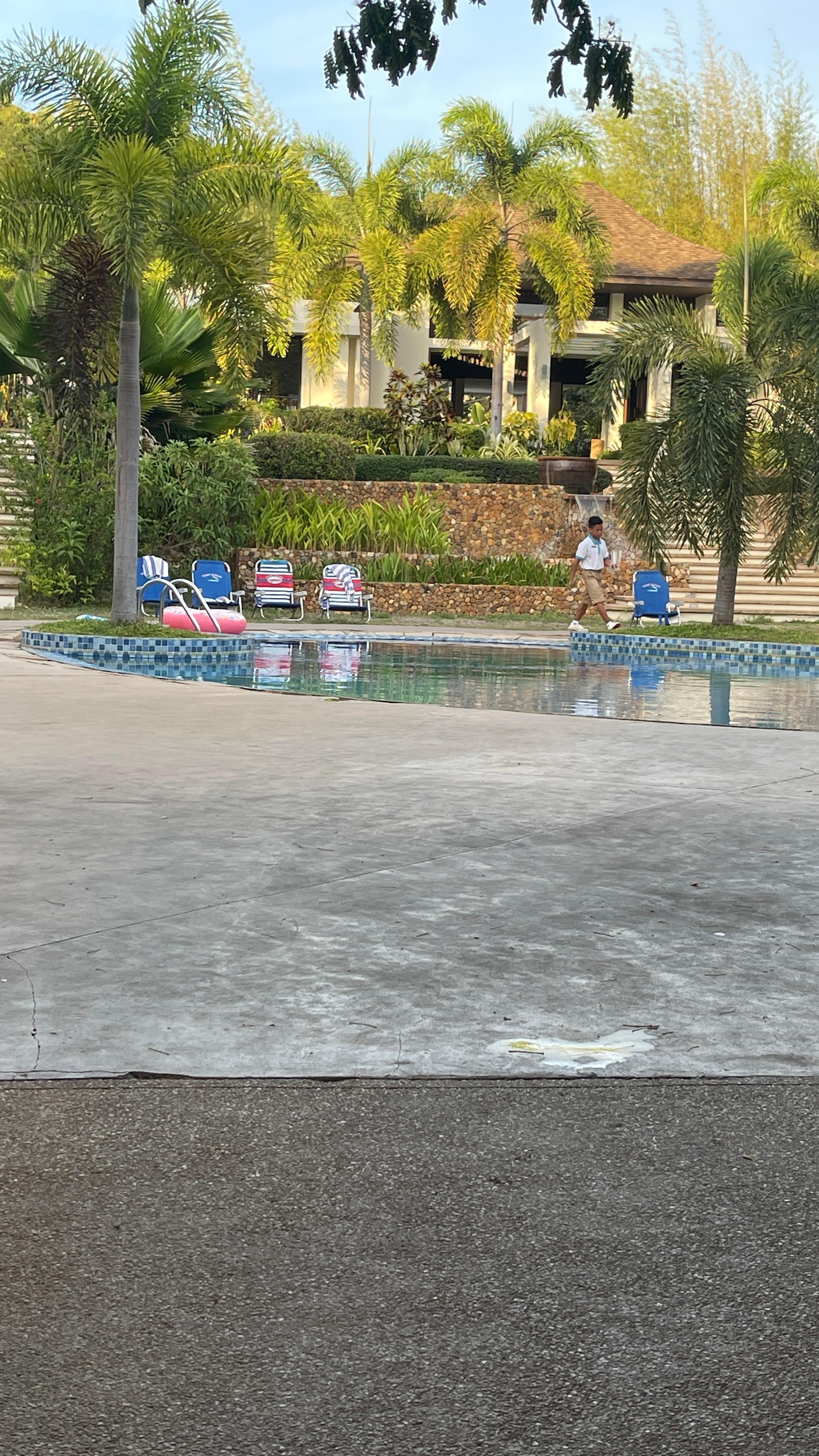The “loungers” by the pool are literal baseball chairs 