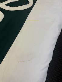 Stains on pillows, bedding, and mattress.