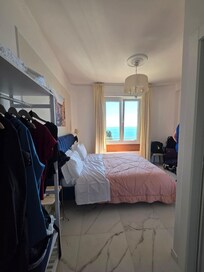 View when coming in the room. Bathroom is at tour right