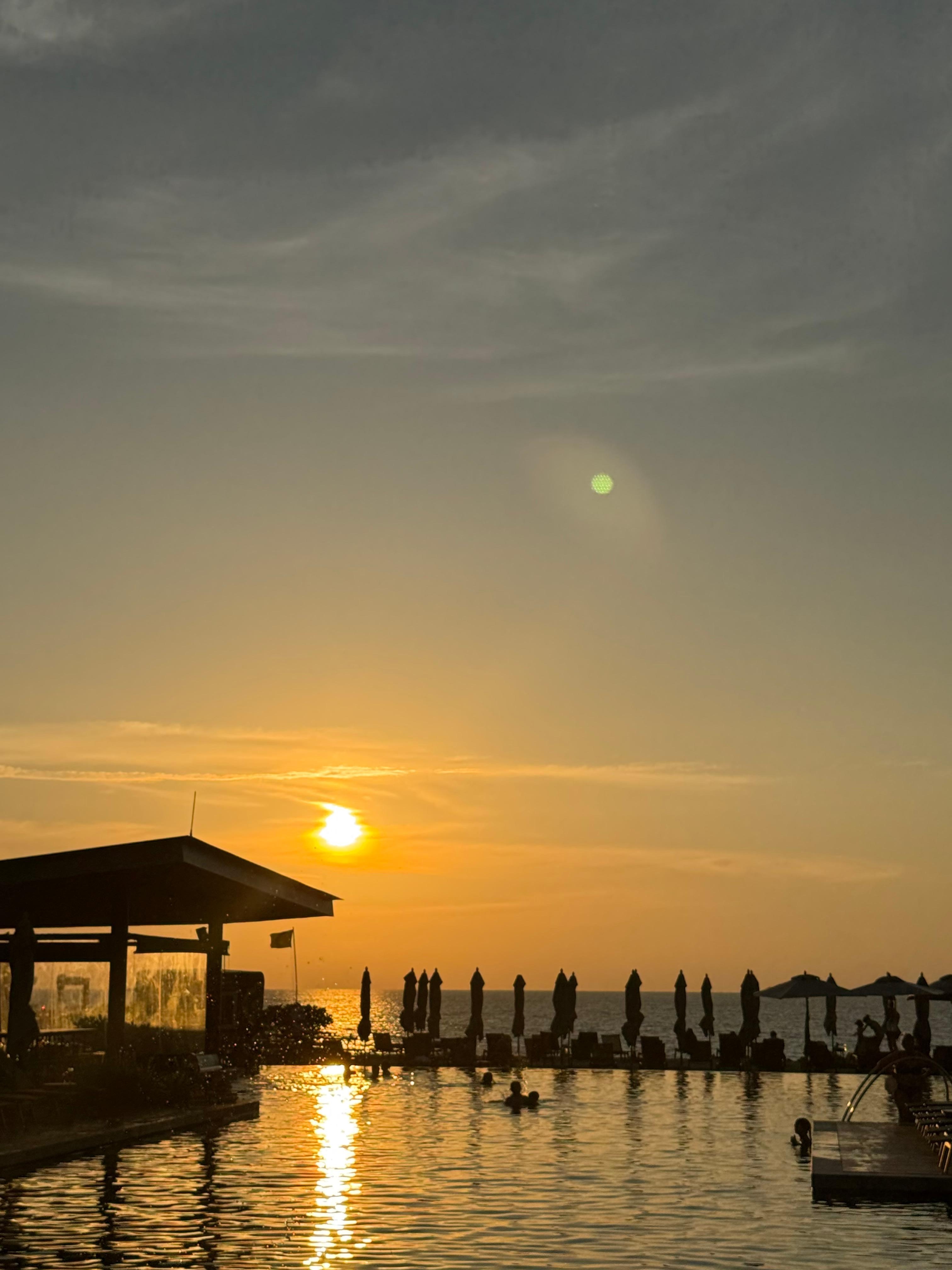 Beach pool and beach at sunset 