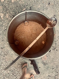 Aşure bubbling over the fire