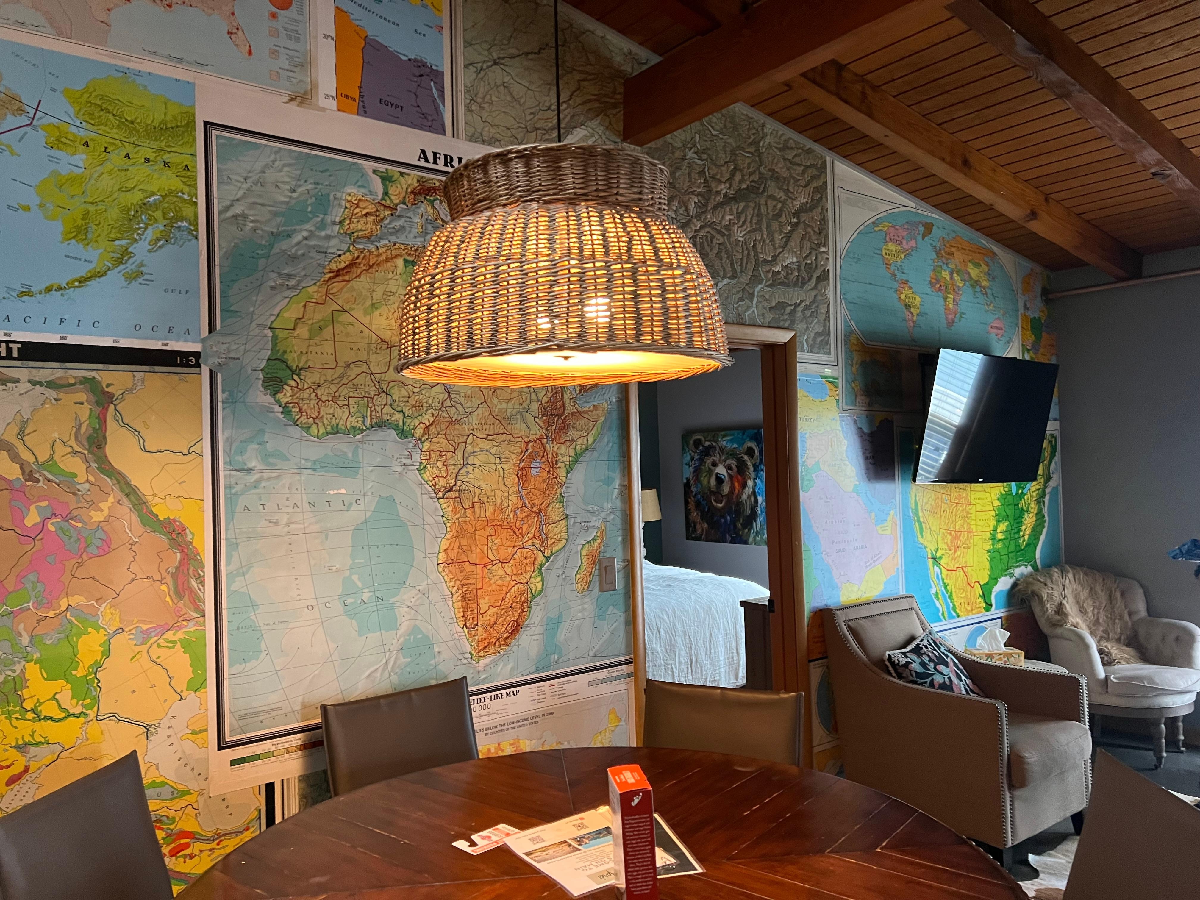 Inside condo - dining space and map wall