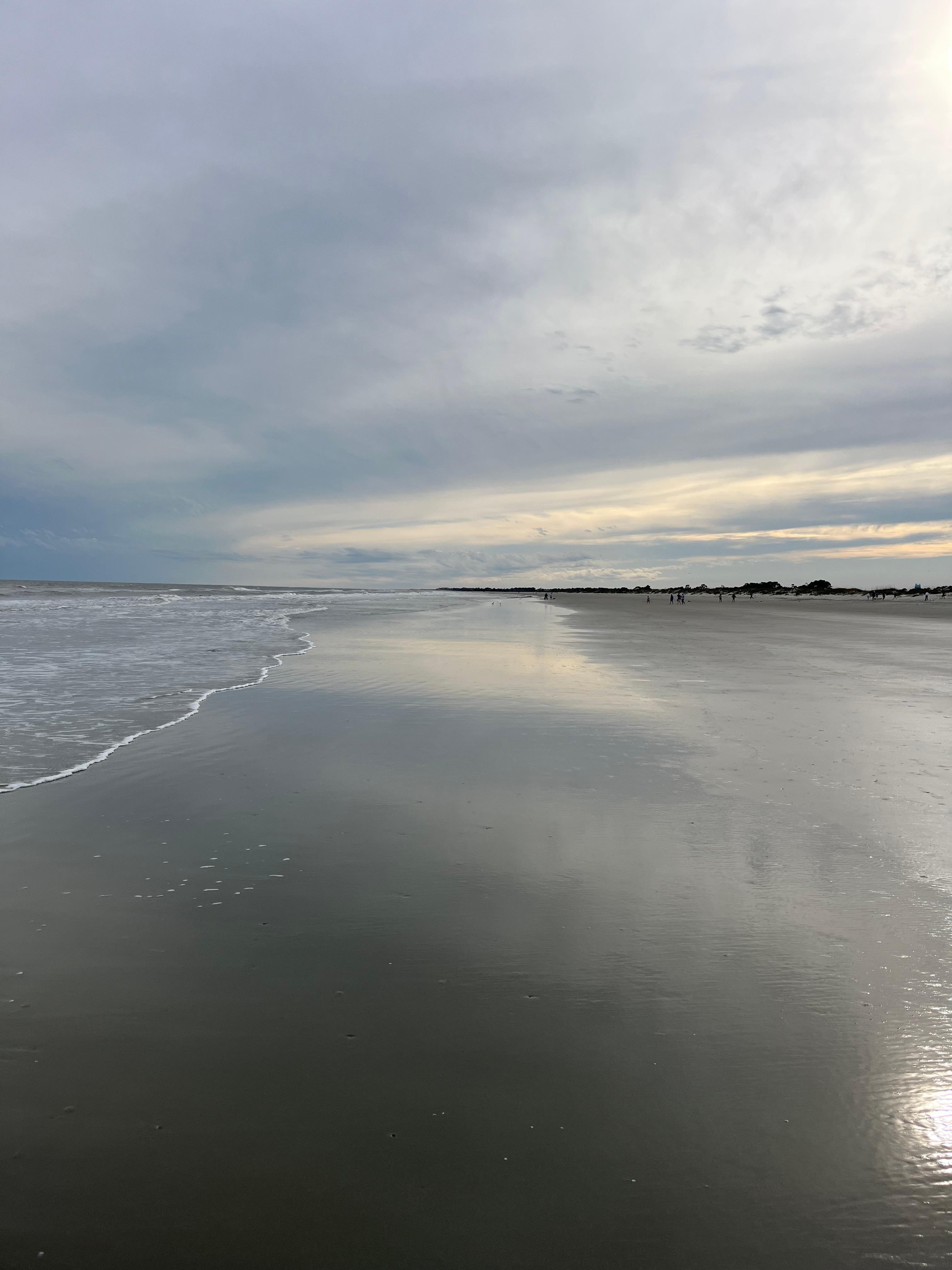 The beach a few minute walks from the home. 