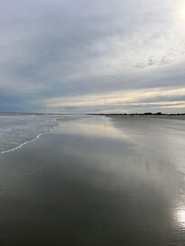 The beach a few minute walks from the home.