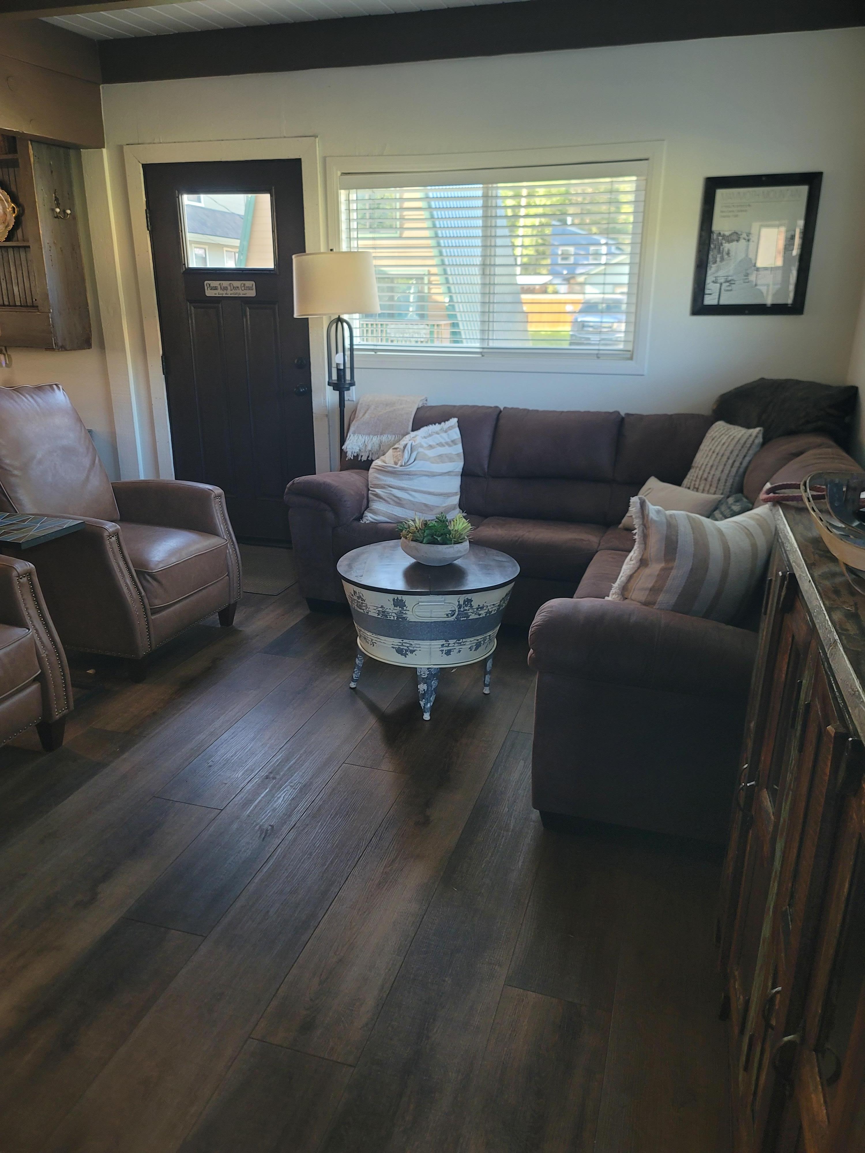 Living room was nicely decorated and spacious for a cabin.