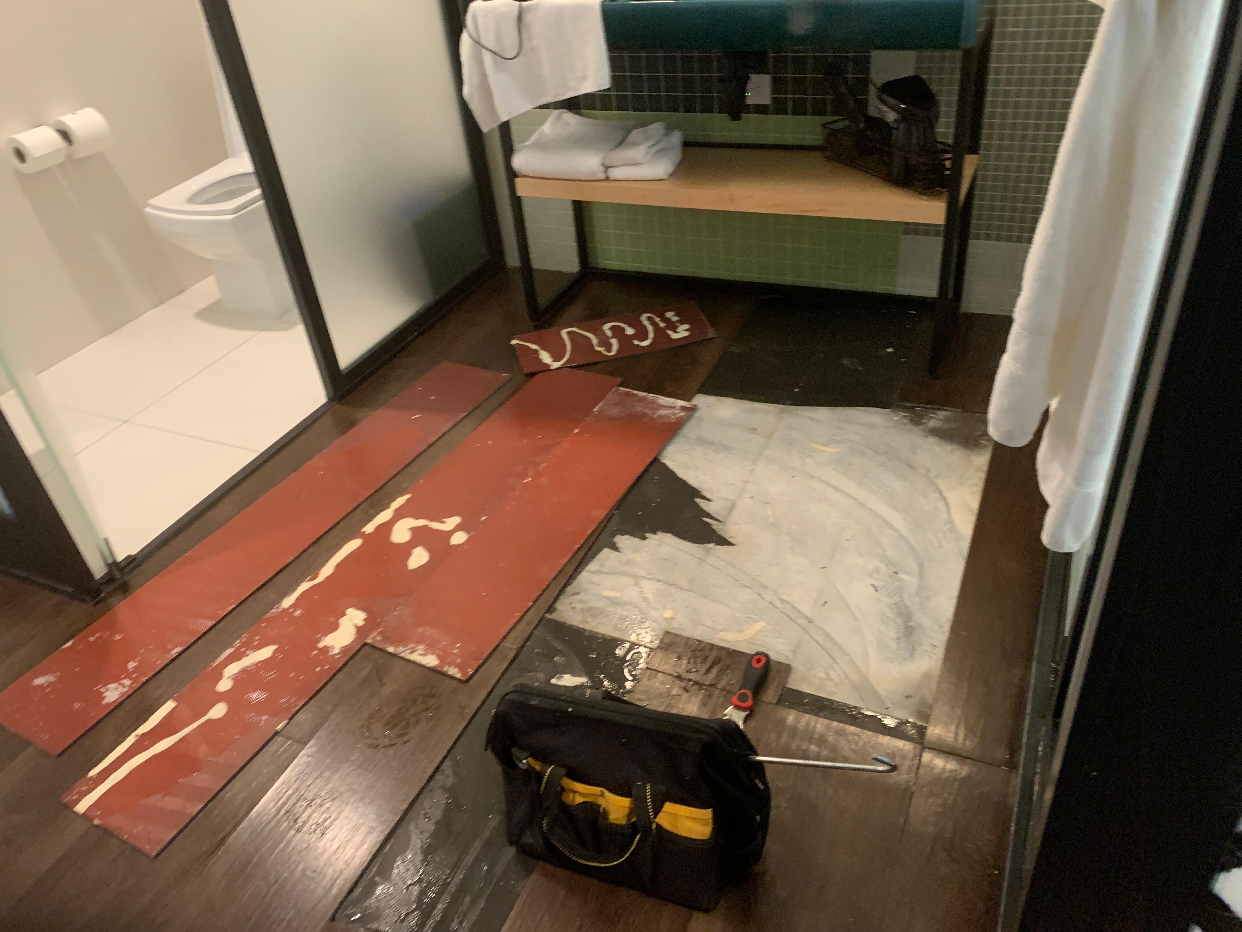 Water seeping from under flooring and resealed with just glue!