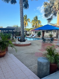 Although a bit too cold for a swim while we were there, covered area in the back had lovely seating options including two hammocks!