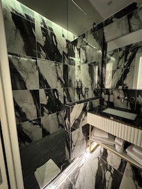 Bathroom view of the shower. They provided shampoo and body wash if needed