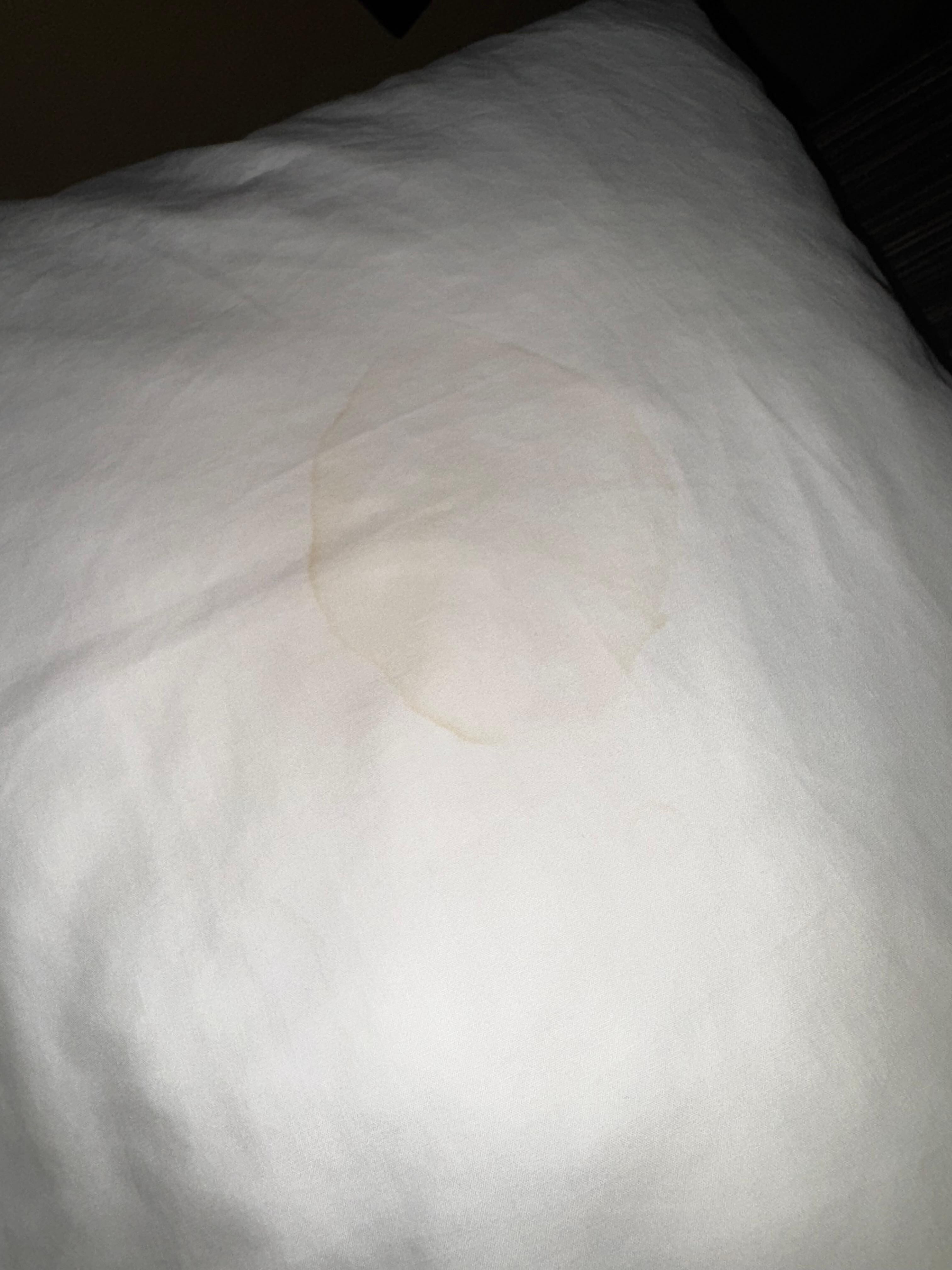 Unknown stain on pillow cover.