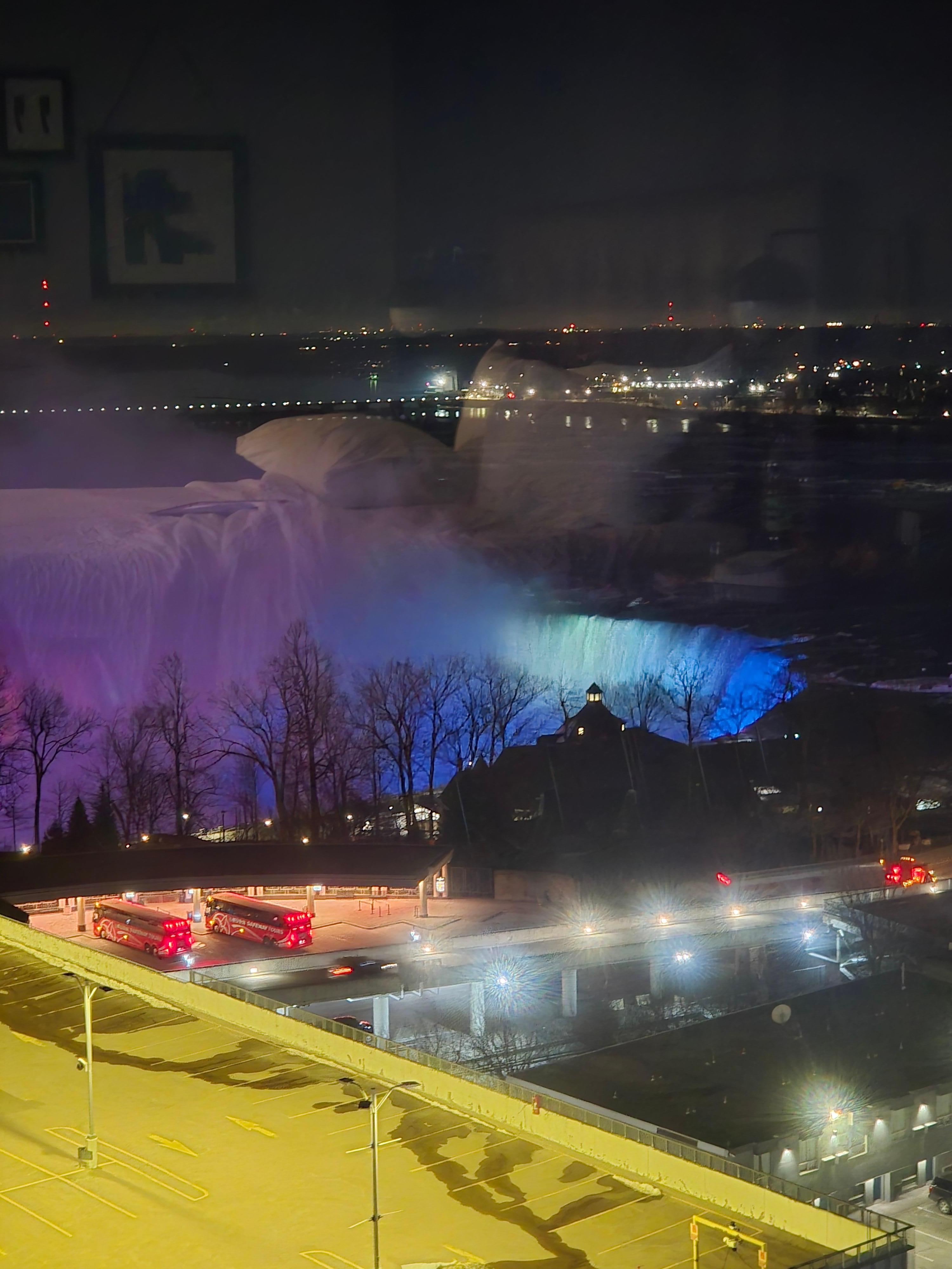 The falls lit up at night.